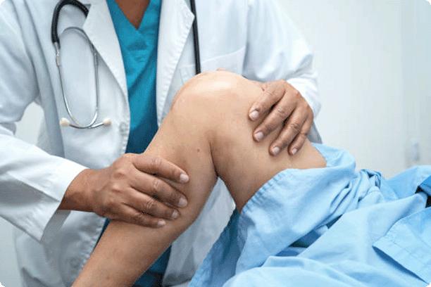 doctor looking at patient's knee