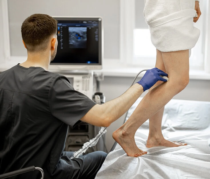 A vein specialist in Boca Raton performs a leg ultrasound for vein disease diagnosis.