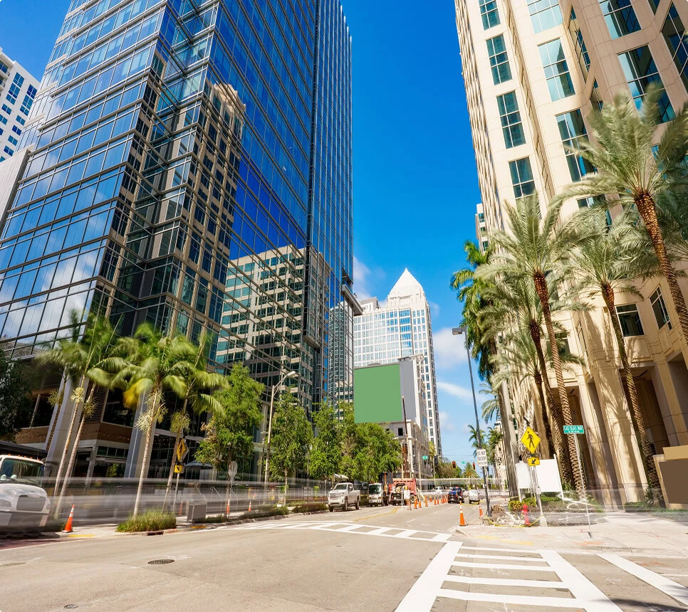Street view near Boca Raton vein treatment center with palm trees and clinics.