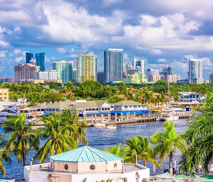 Boca Raton vein treatment center near waterfront with boats and city skyline.