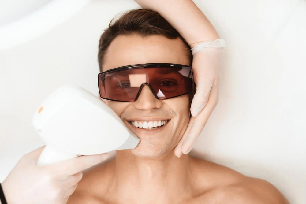 A man receiving laser vein removal trealaser-vein-remotment for chin veins