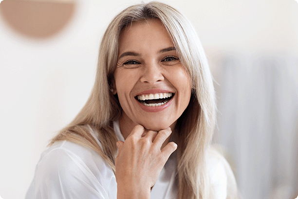 happy middle-aged woman smiling at the camera