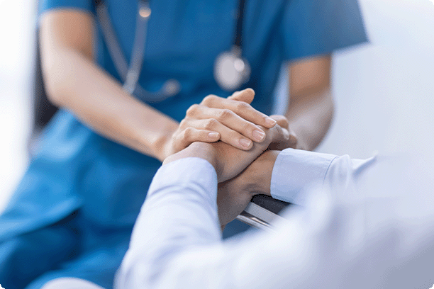 nurse holding patients hands